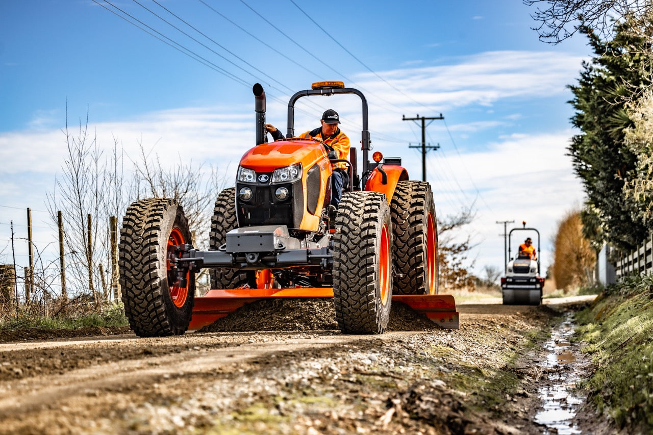 The Neilo M5111 ROP's Tractor Grader grading a driveway